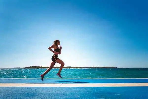 Woman running showing strong leg muscle Sedgley Park